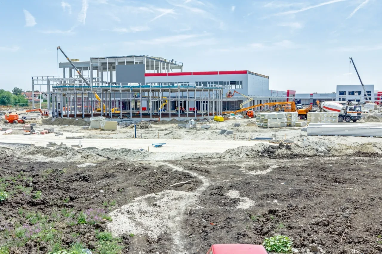 Large commercial building under construction with steel framework